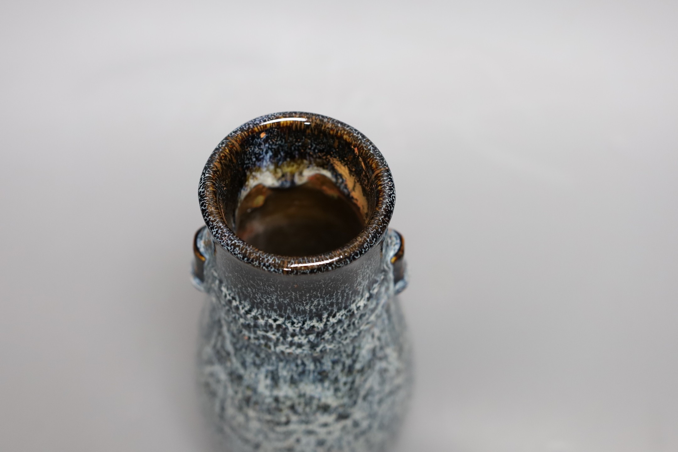 A Chinese Shiwan vase, 23 cms high